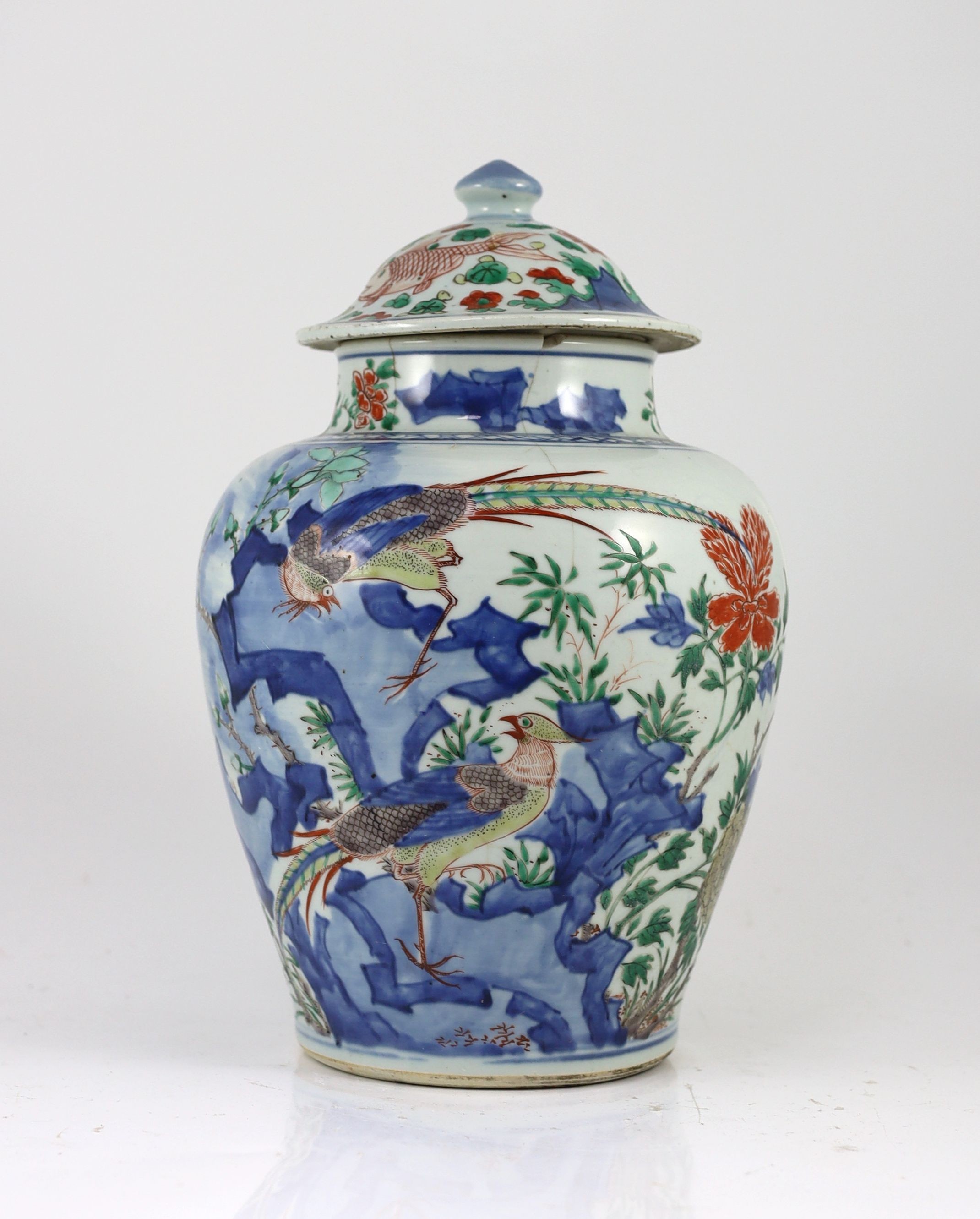 A Chinese transitional wucai jar and cover, c.1650, 36cm high, some damage